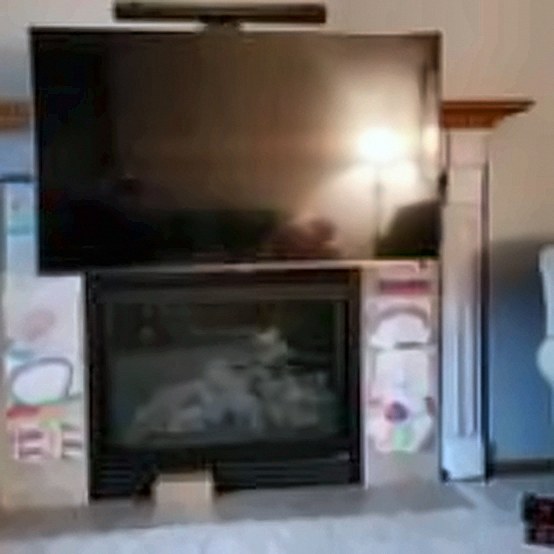 TV and soundbar over a gas fireplace